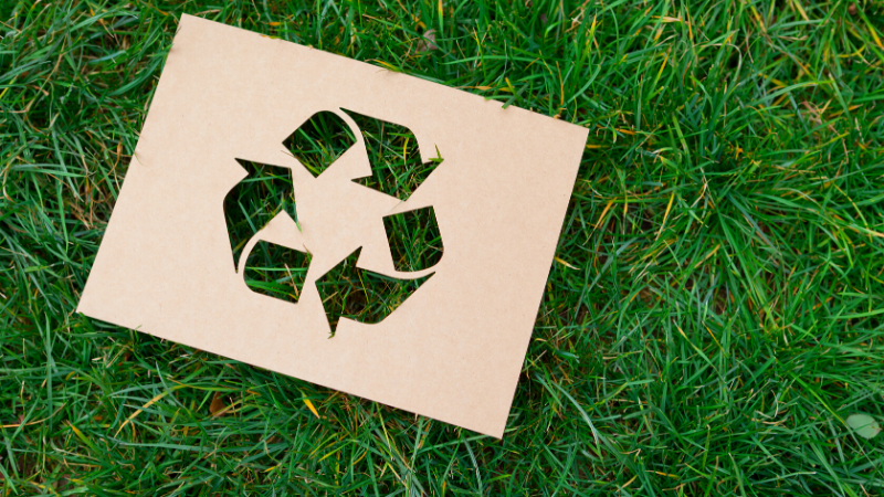 Workit -recycle thumbnail 800x450 recycling at workit spaces - green grass background with a recycling symbol cutout