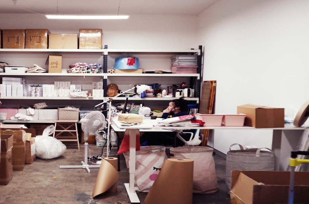 ecommerce merchant in stock room shipping packages