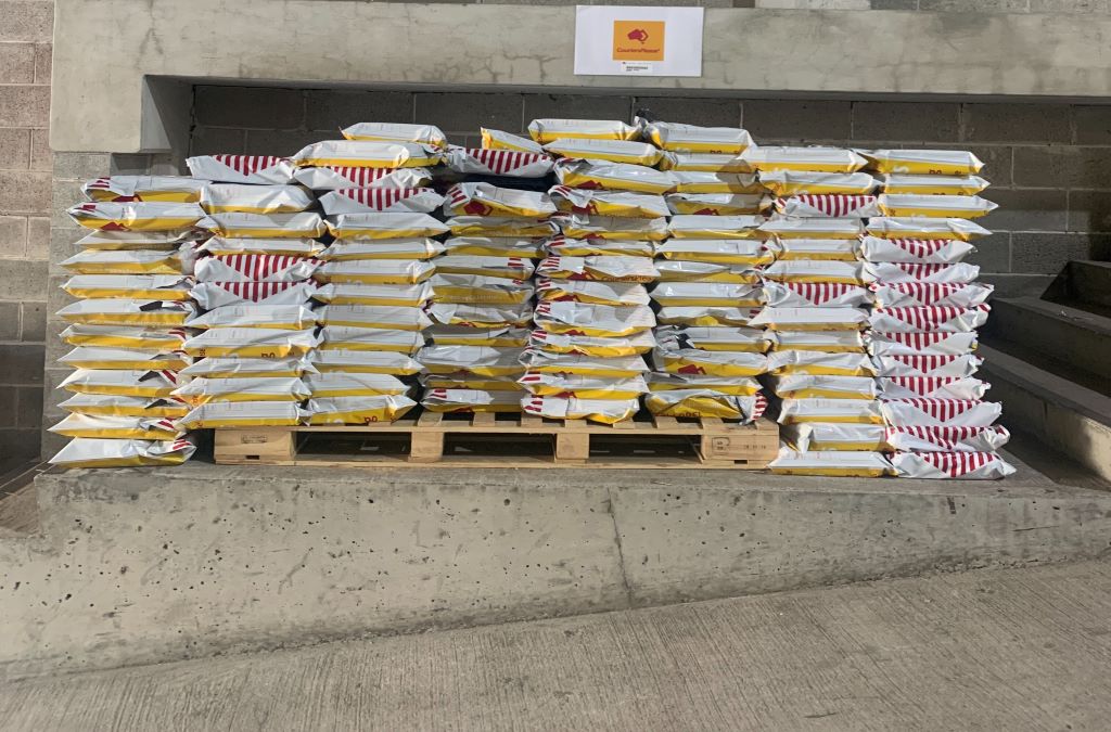 ecommerce packages stacked on a courier pallet